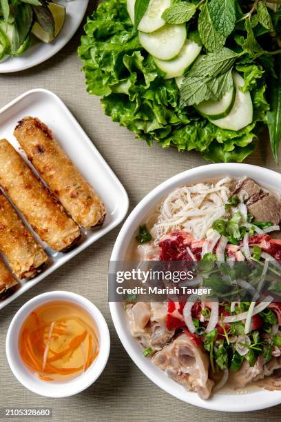 Ph c bit -rib eye, brisket, tendon & tripe rice noodle soup and phn ch giò -fried pork egg rolls served w/vegetables from Golden Deli on Friday, Nov....