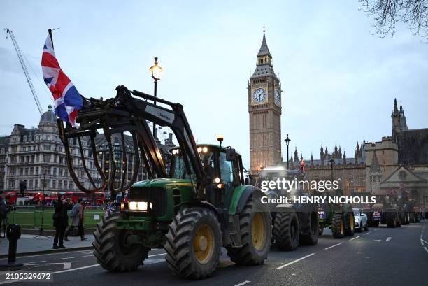 Farmers drive tractors around Parliament Square during a demonstration organised by Save British Farming against UK food policy, substandard imports...
