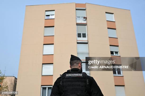 French gendarme stand in front of an apartment building during the "XXL cleanup operation" launched simultaneously in several towns across the...