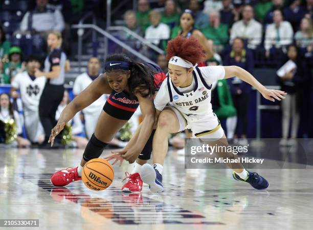 Hannah Hidalgo of the Notre Dame Fighting Irish and Tyia Singleton of the Ole Miss Rebels go after a loose ball during the second round of the 2024...