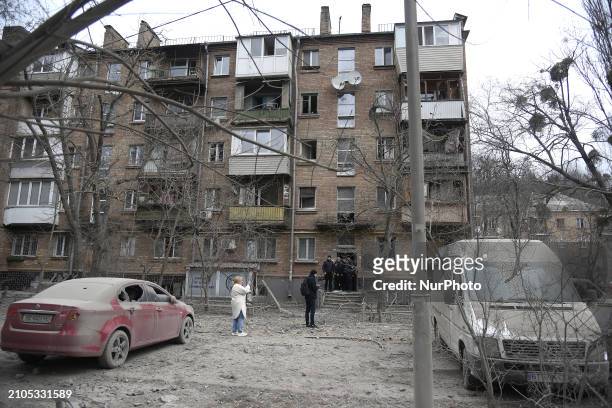 Windows in an apartment building are being smashed by the shock wave from falling missile debris in the Pecherskyi district after two Russian...