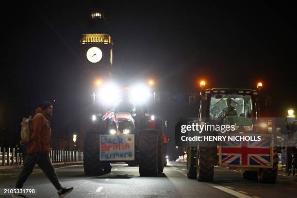 Farmers drive tractors over Westminster Bridge after a demonstration organised by Save British Farming against UK food policy, substandard imports...