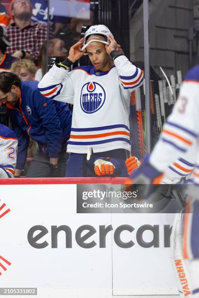 Edmonton Oilers Defenceman Darnell Nurse puts back on his helmet while on a bench after a whistle during third period National Hockey League action...