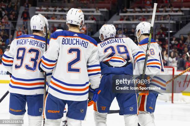 Edmonton Oilers Center Leon Draisaitl celebrates his goal with Center Ryan Nugent-Hopkins , Defenceman Evan Bouchard and Left Wing Zach Hyman during...