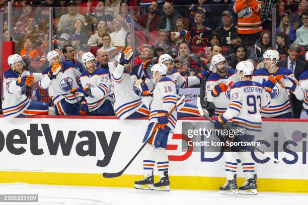 Edmonton Oilers Left Wing Zach Hyman skates by the bench to celebrate his 50th goal of the season during second period National Hockey League action...