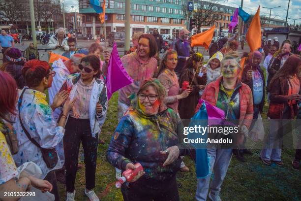 View of the celebration of Holi-Phagwa as they throw colored powder and spray water in the Transvaal district of The Hague, Netherlands on March 25,...