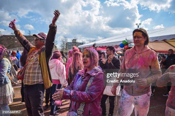 View of the celebration of Holi-Phagwa as they throw colored powder and spray water in the Transvaal district of The Hague, Netherlands on March 25,...