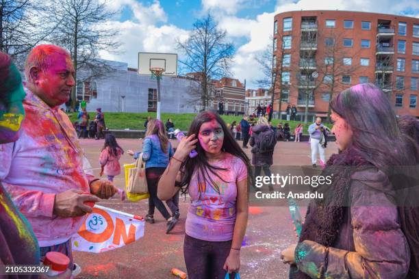 View of the celebration of Holi-Phagwa as they throw colored powder and spray water in the Transvaal district of The Hague, Netherlands on March 25,...