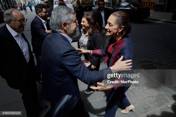 Claudia Sheinbaum, a candidate for the presidency of Mexico from the MORENA Party, is greeting Juan Ramon de la Fuente, the coordinator of the...