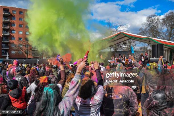 View of the celebration of Holi-Phagwa as they throw colored powder and spray water in the Transvaal district of The Hague, Netherlands on March 25,...