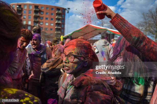 View of the celebration of Holi-Phagwa as they throw colored powder and spray water in the Transvaal district of The Hague, Netherlands on March 25,...