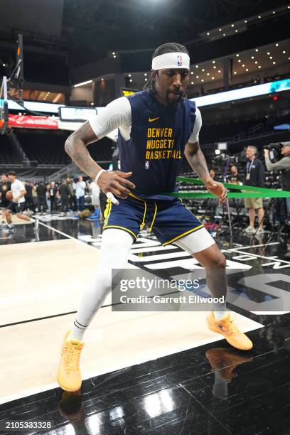 Kentavious Caldwell-Pope of the Denver Nuggets warms up before the game against the San Antonio Spurs on March 14, 2024 at the Moody Center in...