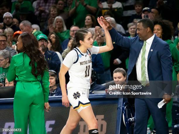 Notre Dame Fighting Irish guard Sonia Citron celebrates with an assistant coach during the game between the Ole Miss Rebels and the Notre Dame...