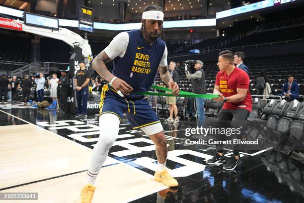 Kentavious Caldwell-Pope of the Denver Nuggets warms up before the game against the San Antonio Spurs on March 14, 2024 at the Moody Center in...