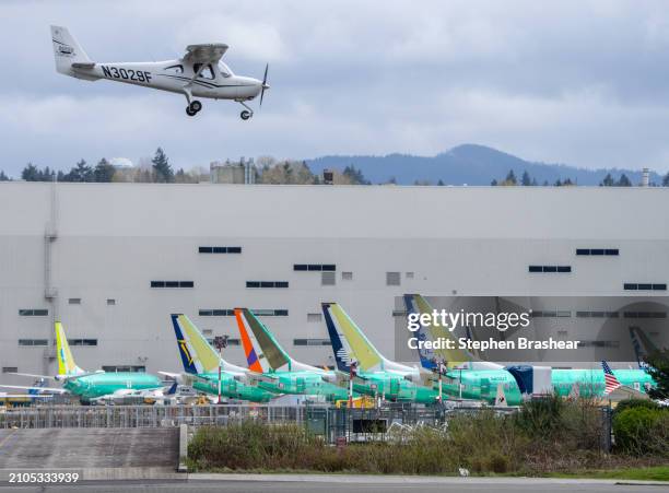 Boeing 737 MAX airplanes are pictured outside a Boeing factory on March 25, 2024 in Renton, Washington. A mid-air door plug blowout on an Alaska...