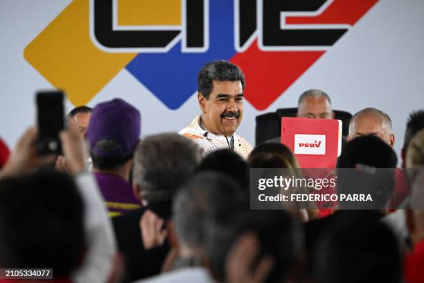 Venezuela's President Nicolas Maduro attends the headquarters of the National Electoral Council to formalize his candidacy before the Venezuelan...