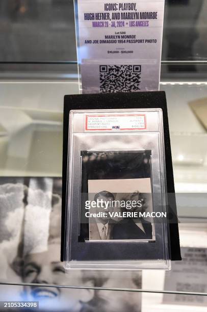 Late US actress Marily Monroe and late US baseball player Joe Dimaggio's 1954 passport photo is displayed during a press preview ahead of the public...