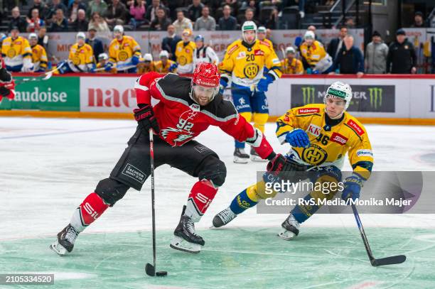 Jiri Sekac of Lausanne HC vies with Dominik Egli of HC Davos during the Swiss National League Play Offs game between Lausanne HC and HC Davos at...