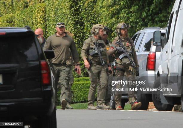 View of law enforcement agents and vehicles outside Diddy's Beverly Hills estate are seen on March 25, 2024 in Los Angeles, California.