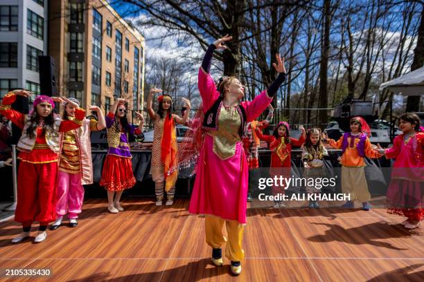 Dancers with traditional dresses performs on the stage during the celebrations. People gathered to celebrate the annual Nowruz in Vienna City,...