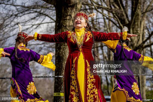 Dancers with traditional dresses performs on the stage during the celebrations. People gathered to celebrate the annual Nowruz in Vienna City,...