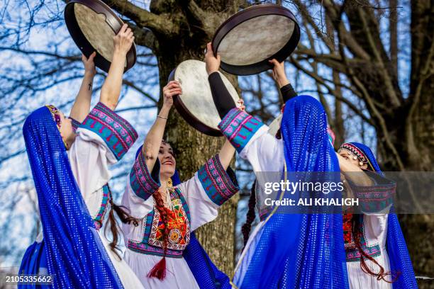 Dancers with traditional dresses performs on the stage during the celebrations. People gathered to celebrate the annual Nowruz in Vienna City,...