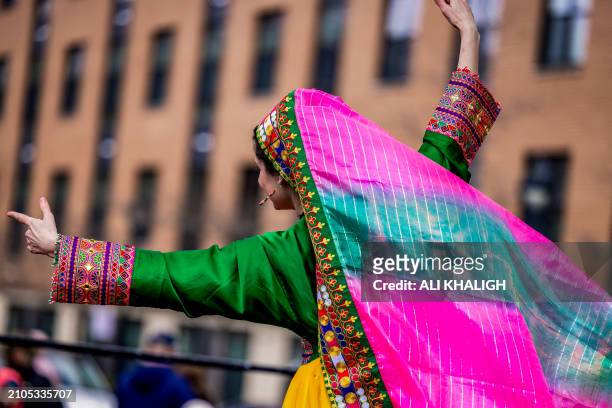 Dancers with traditional dresses performs on the stage during the celebrations. People gathered to celebrate the annual Nowruz in Vienna City,...