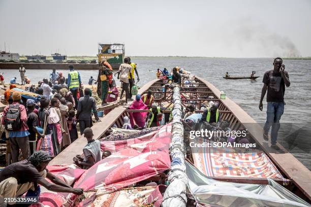 Boats transfer South Sudanese returnees, who fled both South Sudan's war and the more recent war in Sudan, back to their original homes or to be...