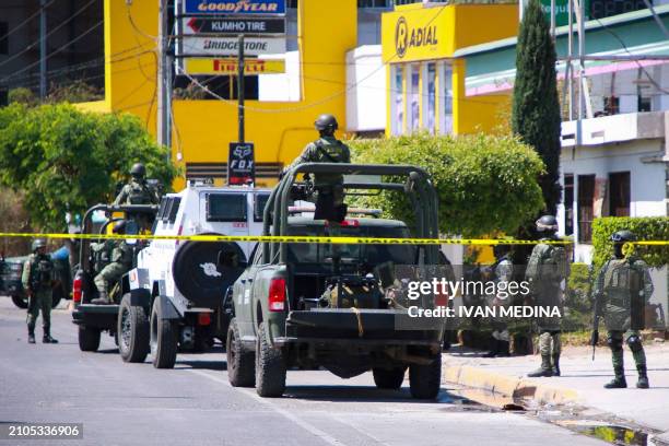 Members of the Mexican Army guard a street in Culiacan, Sinaloa State, Mexico, on March 25 a day after a clash between members of the Mexican...