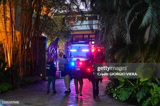 Homeland Security Investigation agents are seen at the entrance of US producer and musician Sean "Diddy" Combs's home at Star Island in Miami Beach...