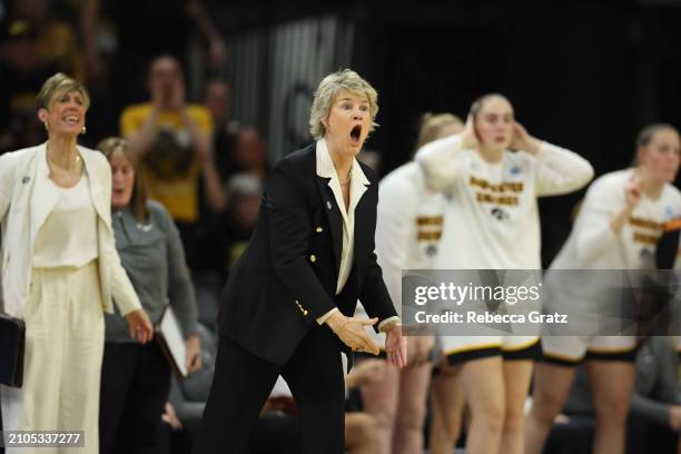 Lisa Bluder, head coach of the Iowa Hawkeyes, calls out to her players in the first quarter against the West Virginia Mountaneers during the second...