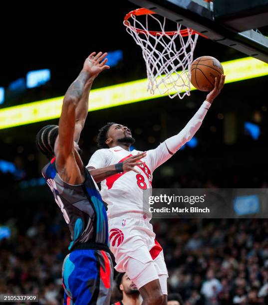 Kobi Simmons of the Toronto Raptors goes to the basket against Nic Claxton of the Brooklyn Nets during the second half of their basketball game at...