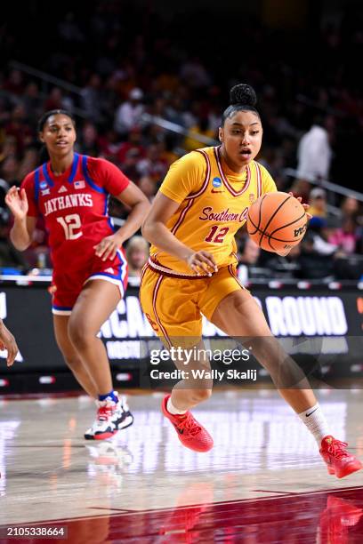 JuJu Watkins of the USC Trojans drives to the basket in front of S'Mya Nichols of the Kansas Jayhawks during the first quarter of the second round of...