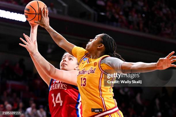 Rayah Marshall of the USC Trojans blocks a shot by Danai Papadopoulou of the Kansas Jayhawks during the first quarter of the second round of the 2024...