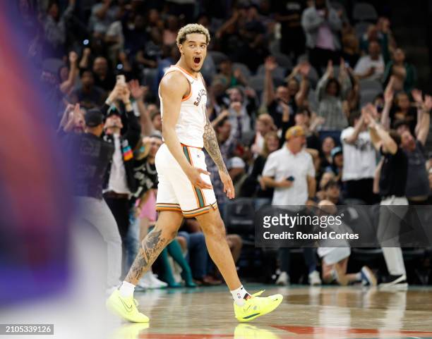 Jeremy Sochan of the San Antonio Spurs reacts after hitting a three that gave the Spurs a victory over the Phoenix Suns at Frost Bank Center on March...