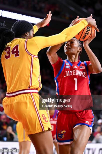 Clarice Akunwafo of the USC Trojans defends a shot by Taiyanna Jackson of the Kansas Jayhawks during the first quarter of the second round of the...