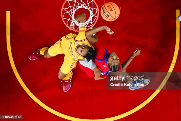 Rayah Marshall of the USC Trojans and Taiyanna Jackson of the Kansas Jayhawks battle for positioning on a rebound during the third quarter in the...