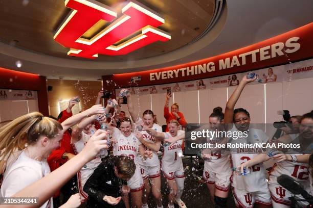 The Indiana Hoosiers celebrate in the locker room after defeating the Oklahoma Sooners during the second round of the 2024 NCAA Women's Basketball...