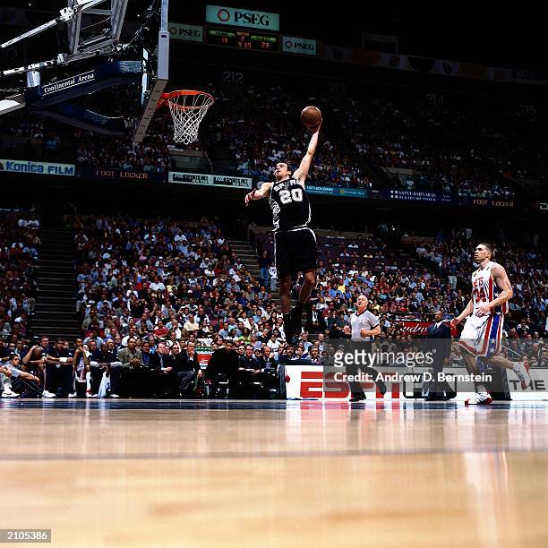 Emanuel Ginobili of the San Antonio Spurs dunks against the New Jersey Nets during Game five of the NBA Finals at the Continental Airlines Arena on...