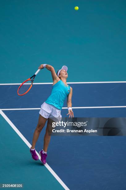 Nadia Podoroska of Argentina hits a serve against Coco Gauff of the United States on day 7 during their match of the Miami Open at Hard Rock Stadium...