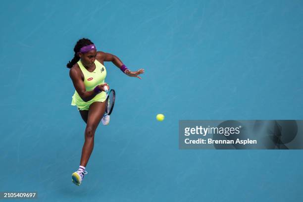 Coco Gauff of the United States returns a shot against Nadia Podoroska from Argentina during their match on day 7 of the Miami Open at Hard Rock...