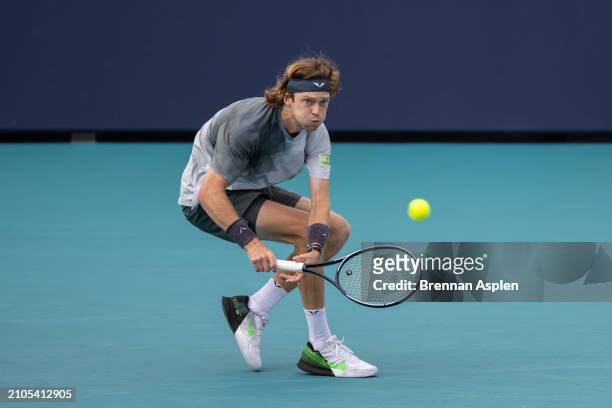 Andrey Rublev hits a shot against Tomas Macha of the Czech Republic during their match on day 7 of the Miami Open at Hard Rock Stadium on March 22,...