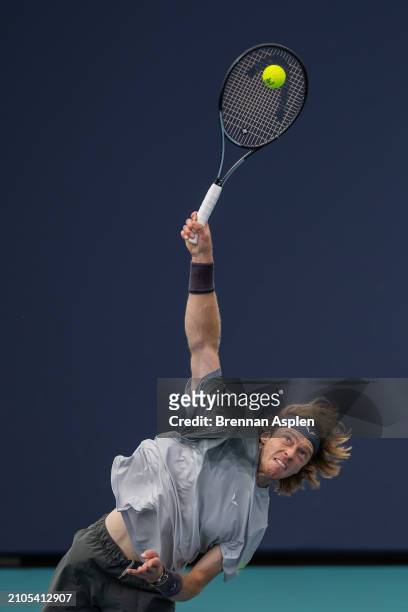 Andrey Rublev hits a serve against Tomas Macha of the Czech Republic during their match on day 7 of the Miami Open at Hard Rock Stadium on March 22,...