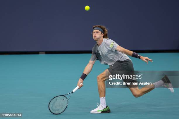 Andrey Rublev hits a shot against Tomas Macha of the Czech Republic during their match on day 7 of the Miami Open at Hard Rock Stadium on March 22,...
