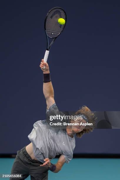 Andrey Rublev hits a serve against Tomas Macha of the Czech Republic during their match on day 7 of the Miami Open at Hard Rock Stadium on March 22,...