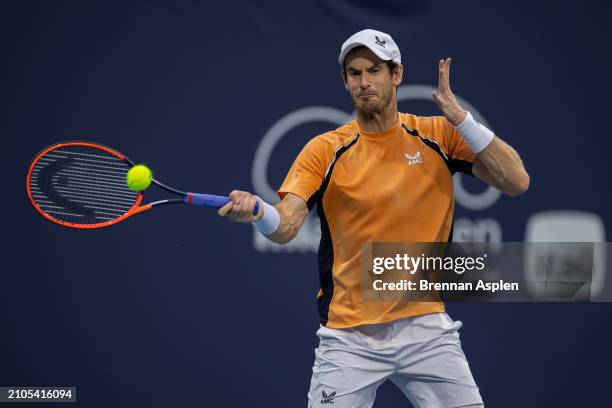 Andy Murray of the United Kingdom hits a shot against Tomás Martín Etcheverry of Argentina during their match on day 7 of the Miami Open at Hard Rock...