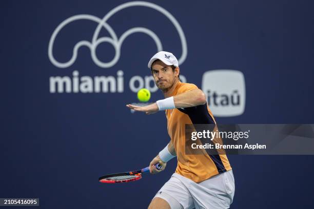 Andy Murray of the United Kingdom hits a shot against Tomás Martín Etcheverry of Argentina during their match on day 7 of the Miami Open at Hard Rock...