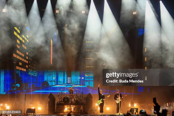 Travis Barker, Mark Hoppus and Tom DeLonge of Blink-182 perform live on stage during day one of Lollapalooza Brazil at Autodromo de Interlagos on...