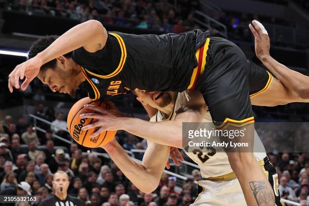 Zach Edey of the Purdue Boilermakers is fouled by Jimel Cofer of the Grambling State Tigers during the second half in the first round of the NCAA...