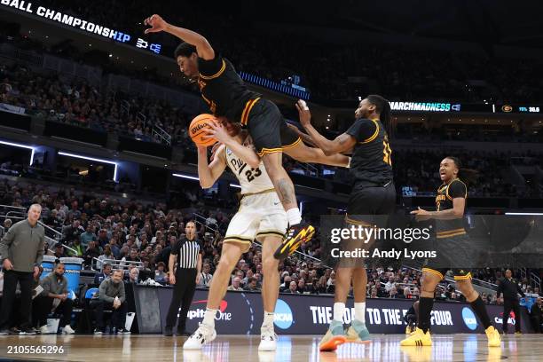 Zach Edey of the Purdue Boilermakers is fouled by Jimel Cofer of the Grambling State Tigers during the second half in the first round of the NCAA...